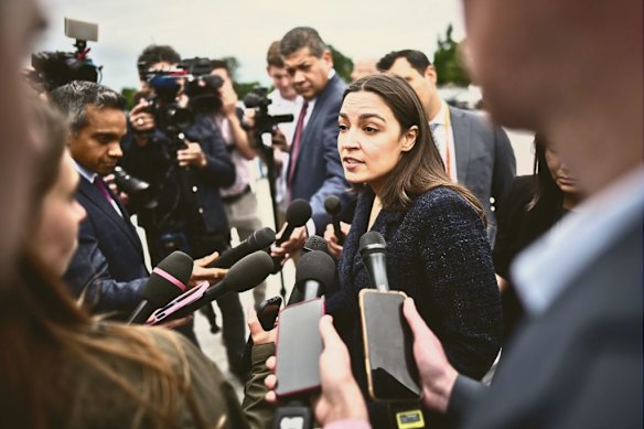 Alexandria Ocasio-Cortez speaks to journalists in Washington in May. 