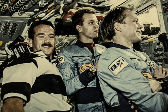 Canadian CSA astronaut Chris Hadfield, Ukrainian-born Russian cosmonaut Yuri Gidzenko, and Russian cosmonaut Sergey Avdeev inspect the Russian Space Station Mir. 