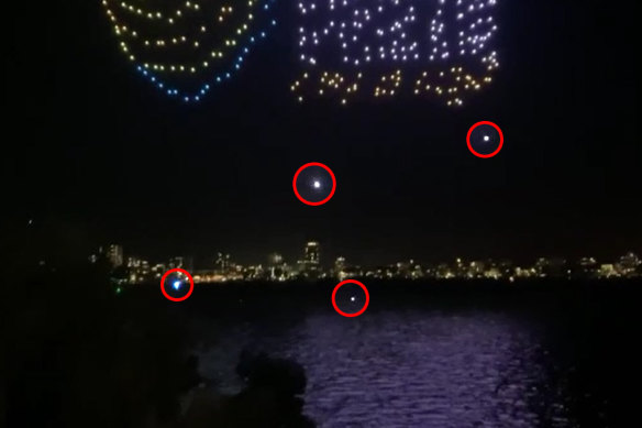 Some of the estimated 50 drones falling from the sky during the drone show.