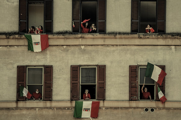 In the Rome suburb of Garbatella, residents in pandemic lockdown in 2020 come out to sing the anti-fascist song Bella Ciao on Liberation Day, marking the end of the Nazi occupation in WWII.  