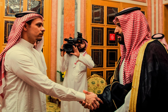 In this photo from the Saudi Press Agency in 2018, the Crown Prince shakes hands with Khashoggi’s son Salah, who was under a travel ban.