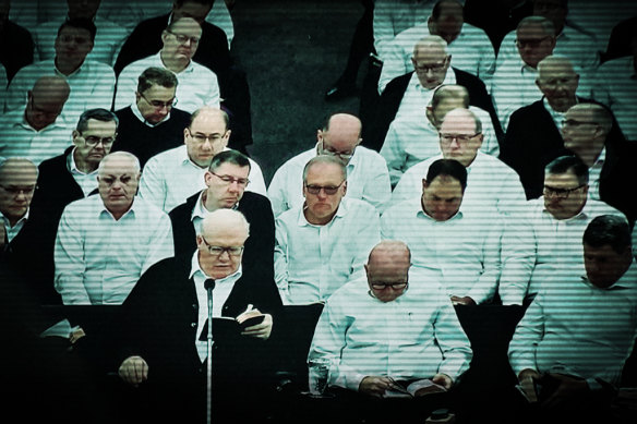 Bruce Hales (front left), the global leader or the Plymouth Brethren Christian Church, preaches in the US.