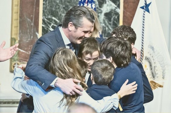 Pete Hegseth hugs his children after being sworn in as secretary of defence (now secretary of war) in Washington, DC, on January 25, 2025.