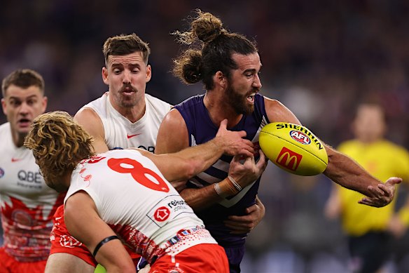 Alex Pearce of the Dockers contests for the ball against Jake Lloyd of the Swans.