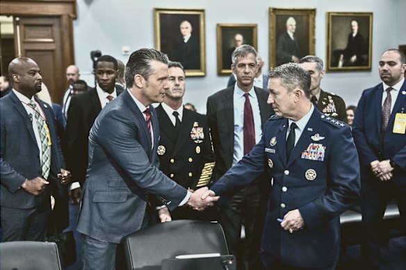 Pete Hegseth and Dan Caine arrive to testify about the defence budget on May 12.