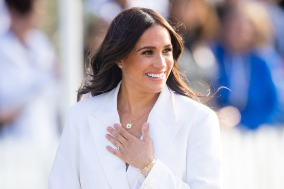 Meghan loves to play against type, pictured here, mixing a piece of hand jewellery from Catbird with a Cartier watch from Princess Diana.