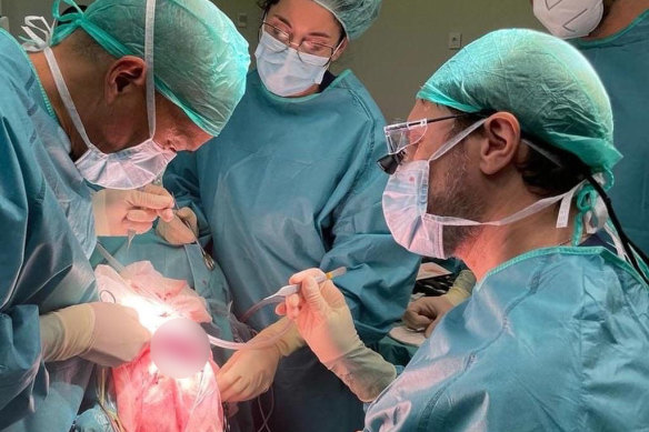 Teo (left) operating on a patient’s brain in Spain last November.