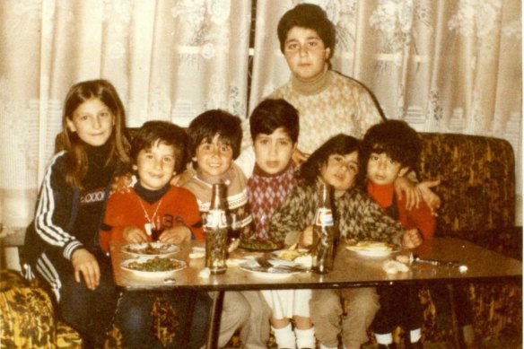 Kerbaj sitting next to his sister Suzan, far left, in Lebanon.