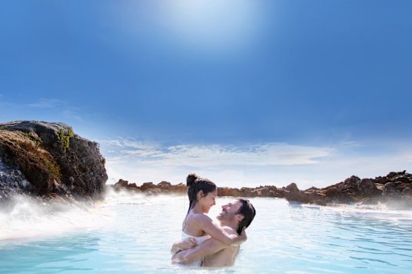 Iceland's Blue Lagoon - Geothermal waters in a lava area framed by Dramatic Thorbjorn Mountain.