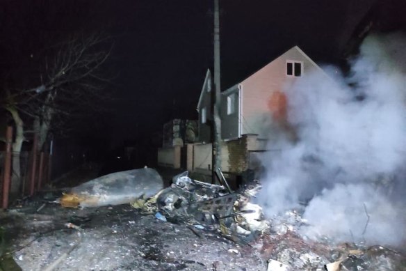 Emergency services images of a jet crashed into Kyiv suburbs