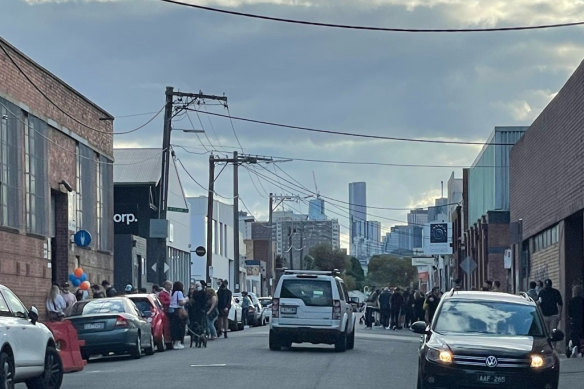 An event in Richmond on Saturday with people gathered on the street.