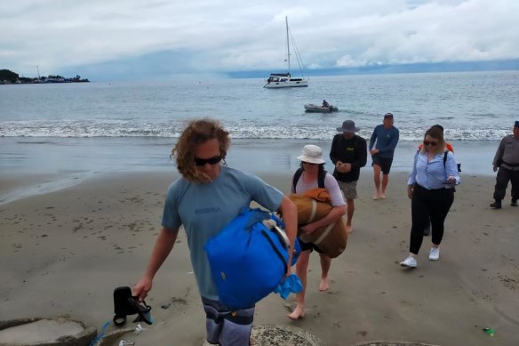 The four Australian surfers arrive on the island of Nias, Indonesia, to be transferred to Australia, after their 36-hour lost-at-sea ordeal this week. 