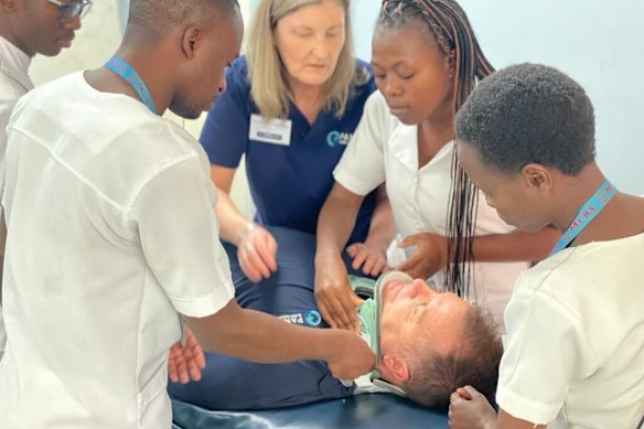 Kate Drummond (centre, standing) in Malawi.