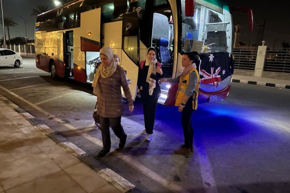 DFAT officials assist Australians evacuating Gaza at the Rafah crossing earlier this month.