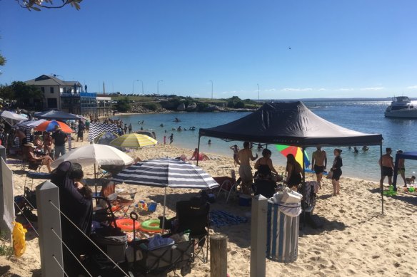 Beachgoers enjoy the warm weather at Frenchman’s beach. 