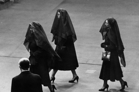 Queen Elizabeth, the Queen Mother, Queen Elizabeth II and Princess Margaret Rose wearing veils during their journey between Sandringham Castle and Buckingham Palace to attend the funeral of King George VI in February 1952.