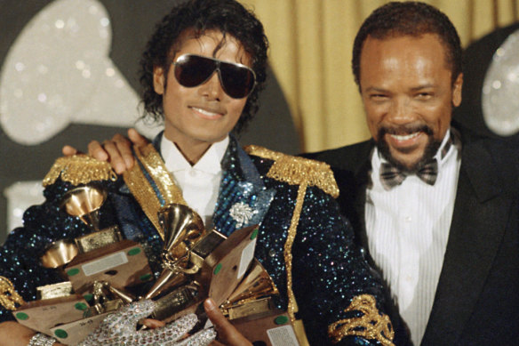 Michael Jackson (left) holds eight awards as he poses with Quincy Jones at the Grammy Awards in Los Angeles in 1984.