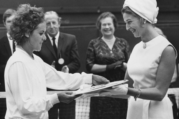 Evonne Goolagong is presented with the Venus Rosewater Dish after winning Wimbledon in 1971.