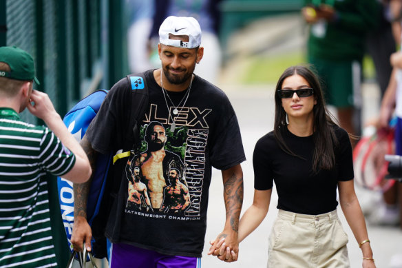 Kyrgios walking through Wimbledon with new girlfriend Costeen Hatzi.