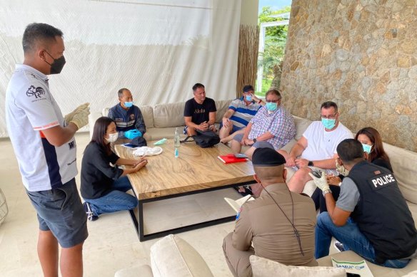 Police speak with Shane Warne’s friends on Saturday morning at Samujana Villas in Koh Samui.