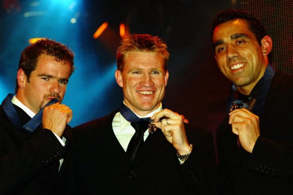Nathan Buckley (centre), Mark Ricciuto (left) and Adam Goodes with their Brownlow Medals in 2003.