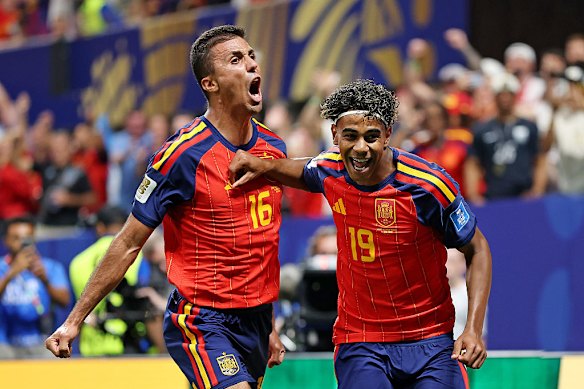 Lamine Yamal (right) celebrates with Rodri after scoring a goal.