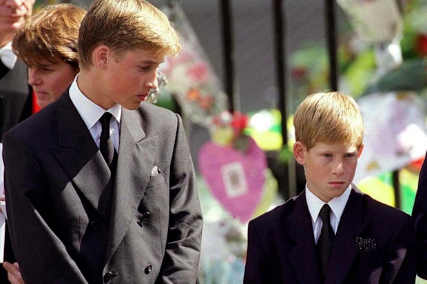 Prince William and Prince Harry stand outside Westminster Abbey at the funeral of Diana, Princess of Wales on September 6, 1997.