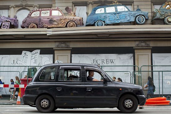 A black London taxi cab in the streets of London.