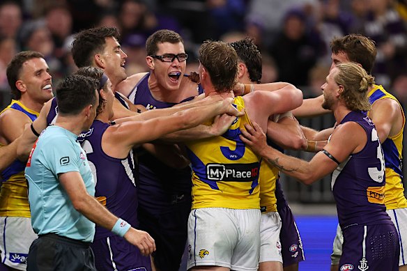 Mason Cox remonstrates with West Coast star Harley Reid as Fremantle got the better of their arch rivals in round 20.