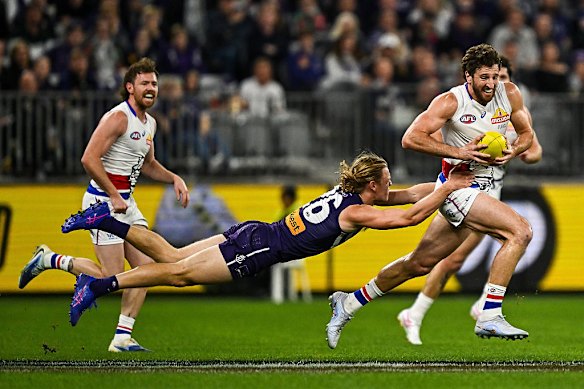 Hayden Young chases down Marcus Bontempelli from the Western Bulldogs as Fremantle continued their winning ways in round 21.