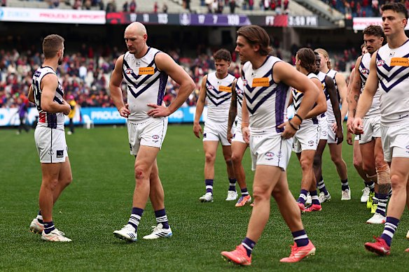 Fremantle players look dejected after losing to Melbourne at the MCG in round 22 in what was described as one of the matches of the season.