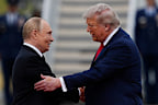 US President Donald Trump greets Russian President Vladimir Putin, on August 15, 2025, at Joint Base Elmendorf-Richardson, Alaska.
