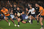 Richie Mo'unga of the All Blacks makes a break to score a try.