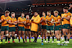 Allan Alaalatoa of the Wallabies speaks to teammates in a huddle.