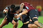 Wallace Sititi of the Chiefs is tackled to the ground.
