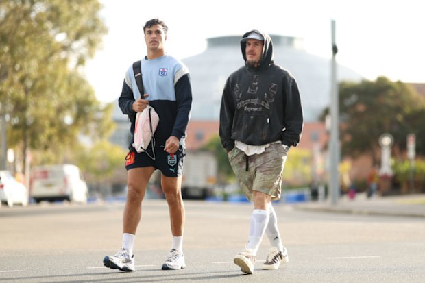 Joseph-Aukuso Suaalii and Angus Crichton walk to the team hotel at Sydney Olympic Park.