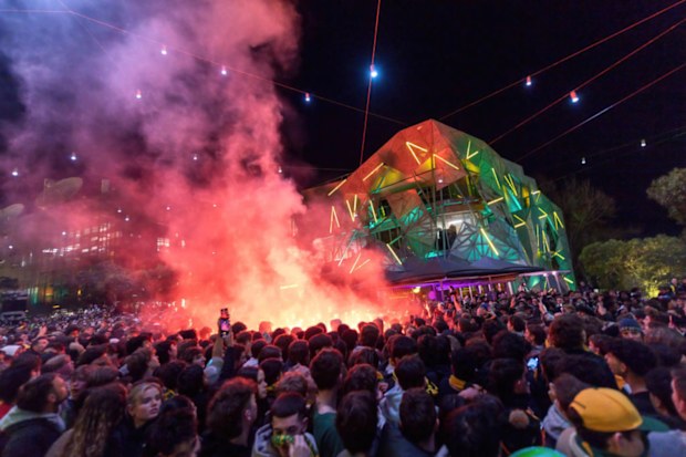Red smoke flares seen in the crowd as Matildas fans watch the game.