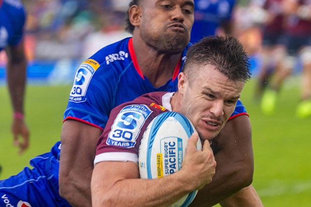 Isaac Henry of the Reds runs with the ball.
