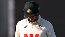 A disappointed Steve Smith walking off the ground.