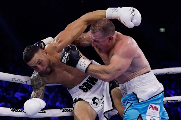  Sonny Bill Williams and Paul Gallen exchange punches during their heavyweight bout.