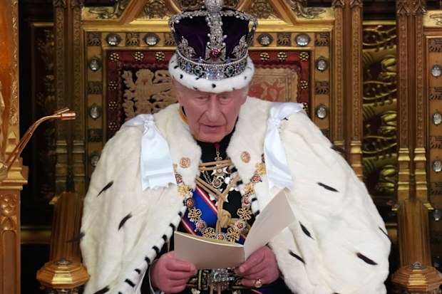 Britain's King Charles III reads out during the State Opening of Parliament at the Palace of Westminster in London, on Wednesday, May 13, 2026.