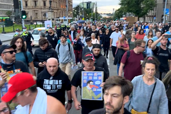 Hundreds protest in Melbourne against vaccine mandates and pandemic legislation.