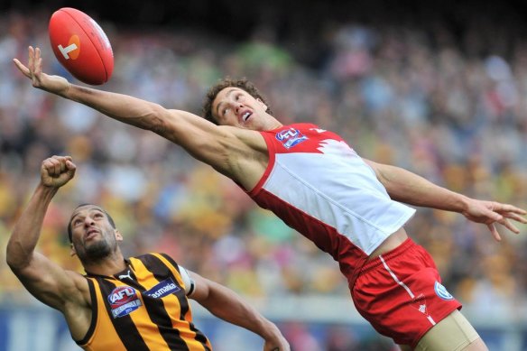 Shane Mumford and Josh Gibson compete for the ball.