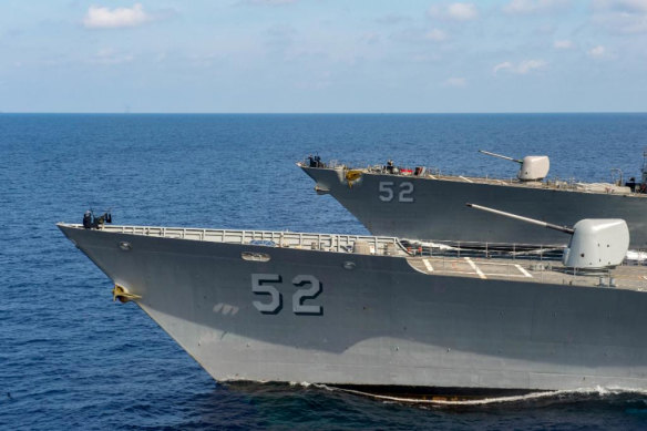 Rising tensions: US Navy ships pass through the South China Sea.