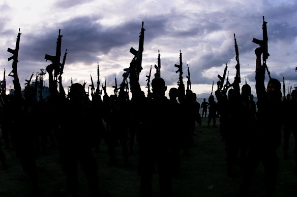 More than 400 Abri army troops, celebrate their departure from Dili, before they are replaced by around the same number of BRIMOB police officers. June 5, 1999.