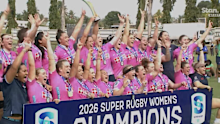The NSW Waratahs lift the trophy.