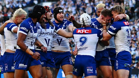 Canterbury Bulldogs celebrate a try against South Sydney Rabbitohs.