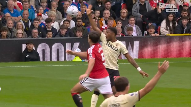 Ipswich players appeal as the ball bounces into the air after striking Harry Maguire’s arm.