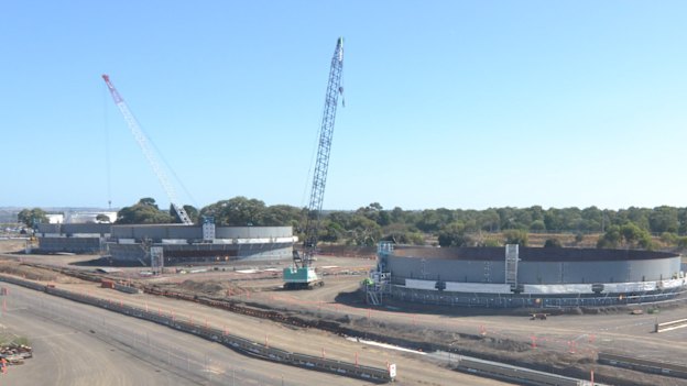 The view from the Corio train station platform of new diesel storage tanks being built at the Geelong oil refinery, one of just two refineries left in Australia.