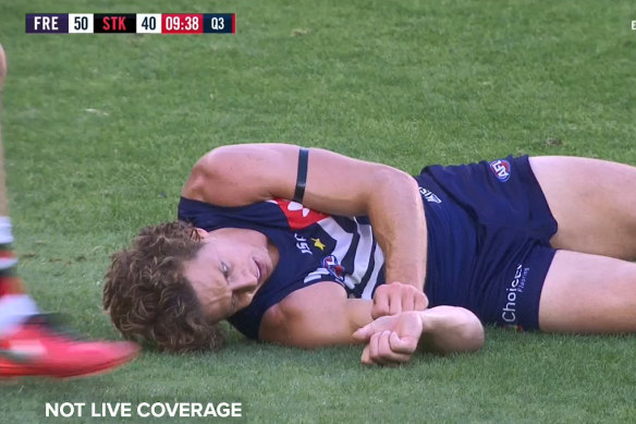 Fremantle's Nat Fyfe had to be helped from the ground after the brutal head clash with St Kilda's Josh Battle.